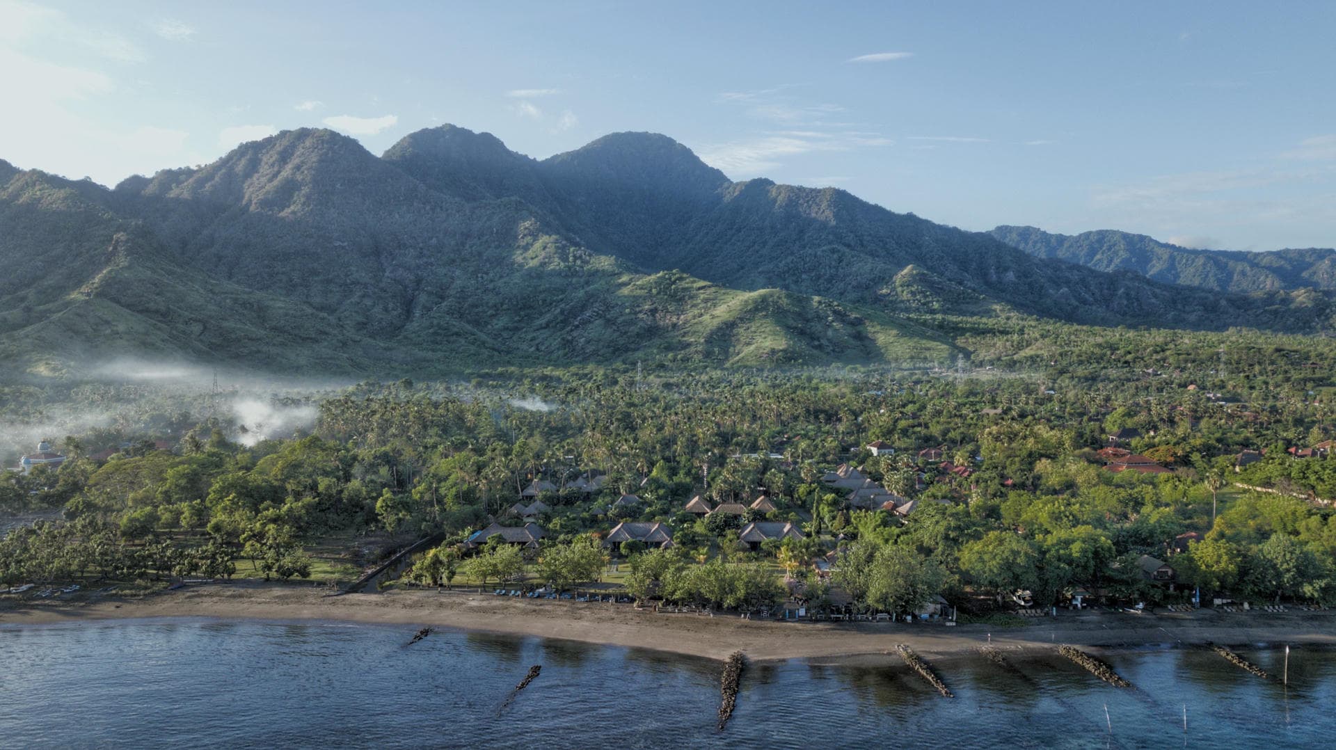 Pemuteran village and the mountain rain-shadow that keeps the bay drier than South Bali